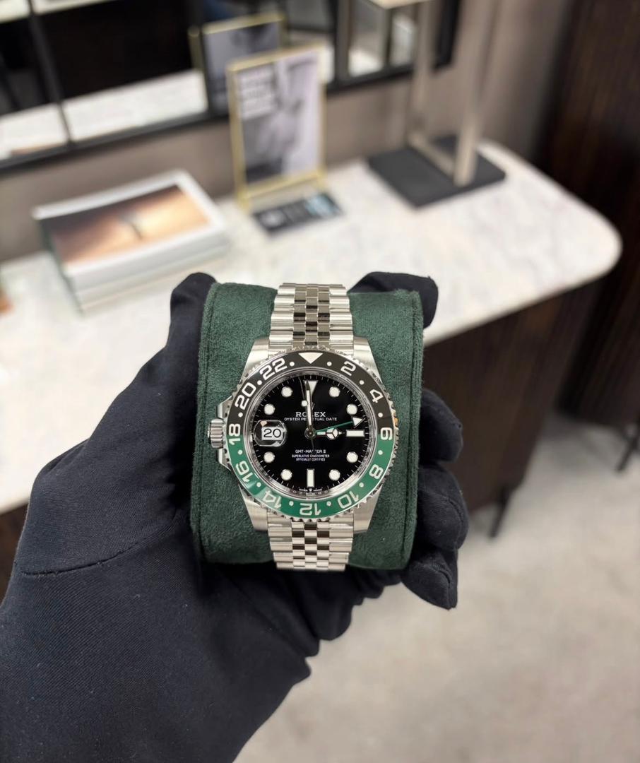 Rolex GMT Master II watch with green and black bezel